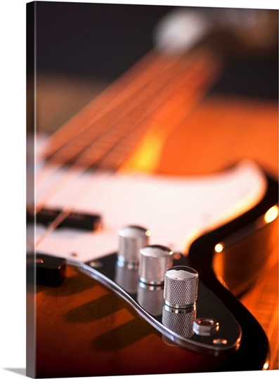 Close up of volume knobs of bass guitar