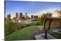 Empty bench at park at sunset.