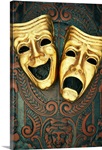 Golden comedy and tragedy masks on patterned leather