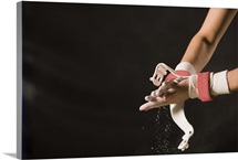 Gymnast chalking up hands
