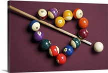 Heart shaped billiard balls with cue ball and stick