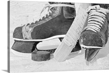 Hockey skates and puck