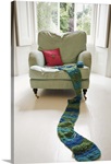 Long knitted scarf on chair