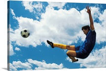 Man kicking soccer ball