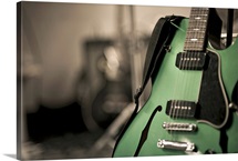 Metallic green hollow-body electric guitar