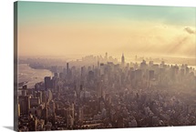 Midtown Manhattan at dusk with Jersey City and Brooklyn in background.