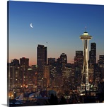 Moon rising over the iconic Space Needle, located in Seattle Washington, USA.