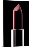 Red lipstick against black background, close-up