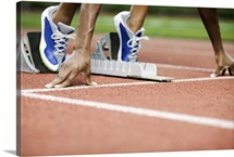 Runner positioned on starting block