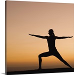 Silhouette of woman doing yoga