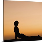 Silhouette of woman doing yoga