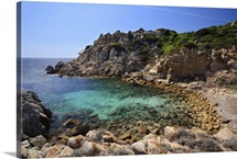 Small deserted beach with clear turquoise water. Mediterranean sea, Corsica, France.
