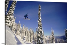 Snowboarding jumping through air , British Columbia , Canada