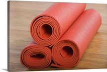 Stack of rolled yoga mats