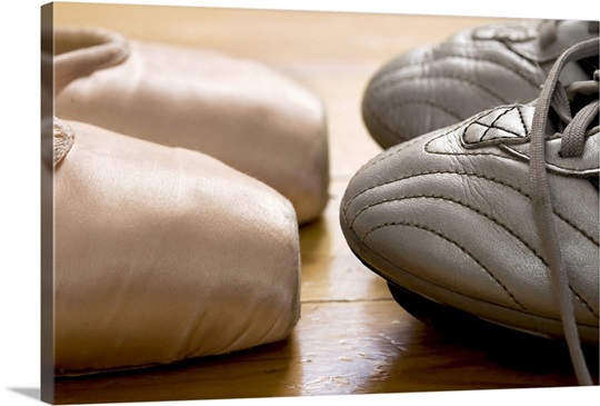 still life of ballet shoes and football boots