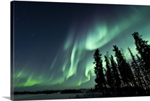 Strong aurora over Walsh Lake, Northwest Territories, Canada.