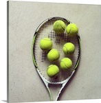 Tennis racquet and tennis balls.