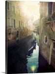 Two gondolas floating in water surrounded by old buildings.