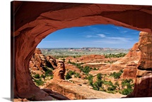 View of Arches National Park looking through Tower Arch.