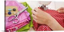 Woman using sewing machine