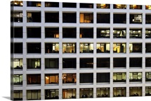 Working later night in office building in financial district of Hong Kong.