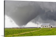 A powerful tornado approaches a church and just misses hitting it