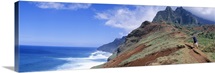 Adult hiking up a mountain, Kalalau Trail , Na Pali Coast, Kauai, Hawaiis