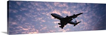 Boeing 747 airplane in flight against evening clouds