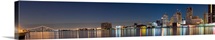 Buildings in a city lit up at dusk, Detroit River, Detroit, Michigan,