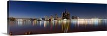 Buildings in a city lit up at dusk, Detroit River, Detroit, Michigan,