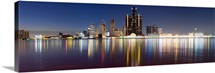 Buildings in a city lit up at dusk, Detroit River, Detroit, Michigan,