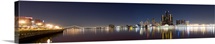 Buildings in a city lit up at dusk, Detroit River, Detroit, Michigan,