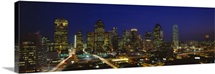 Buildings in a city lit up at night Dallas Texas
