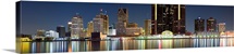 Buildings in a city lit up at night, Detroit River, Detroit, Michigan,