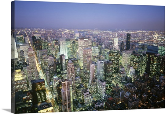 Buildings lit up in a city a night, Manhattan, New York City, New York