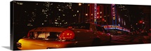 Car on a road, Radio City Music Hall, Rockefeller Center, Manhattan, New York City, New York State