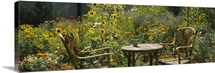 Empty chairs and a table in a garden, Taos, New Mexico