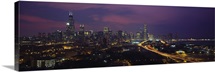 High angle view of buildings lit up at dusk, Chicago, Illinois