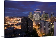 High angle view of buildings lit up at night, Minneapolis, Minnesota
