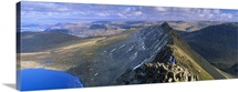 Hikers hiking on a mountain, Striding Edge, Helvellyn, English Lake District, Cumbria, England