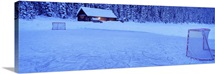Hockey net on a snowcapped landscape, Lake Louise, Alberta, Canada