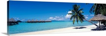 Lounge chair under a beach umbrella, Moana Beach, Bora Bora, French Polynesia