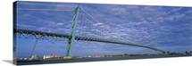 Low angle view of a suspension bridge over the river, Ambassador Bridge, Detroit River, Detroit, Michigan