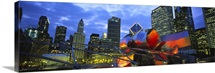 Low angle view of buildings lit up at night, Millennium Park, Chicago, Illinois