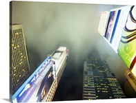 Low angle view of skyscrapers lit up at night, Times Square, Manhattan, New York City, New York State