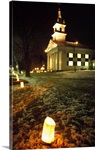 Luminaries outside small church at night, winter, Connecticut