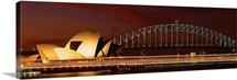 Opera house lit up at night with light streaks, Sydney Harbor Bridge, Sydney Opera House, Sydney, New South Wales, Australia
