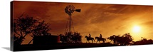 Silhouette of two horse riders at sunset, Hunt, Kerr County, Texas