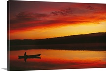 Silhouetted Canoe On Lake