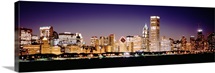 Skyscrapers in a city lit up at night, Chicago, Illinois